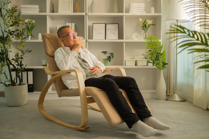Casual Grandpa relaxing in a contemporary rocking chair